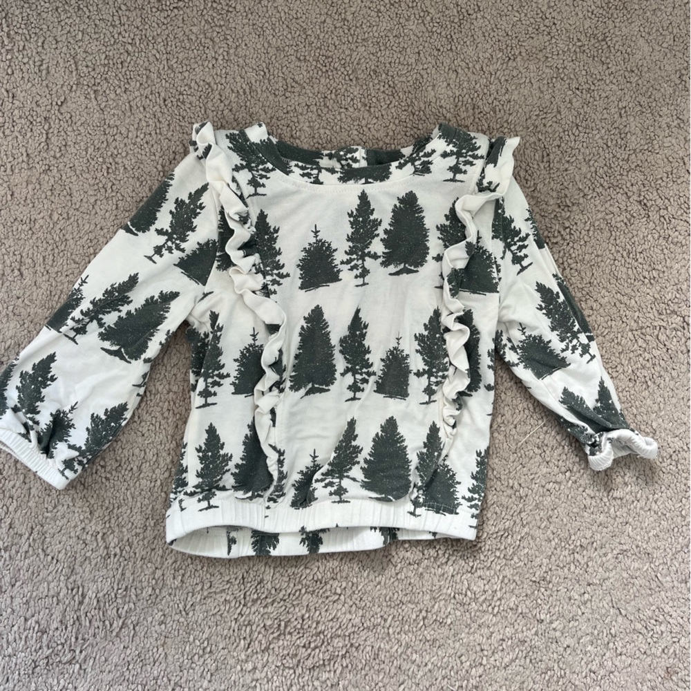 Kate Quinn pine tree ruffle top